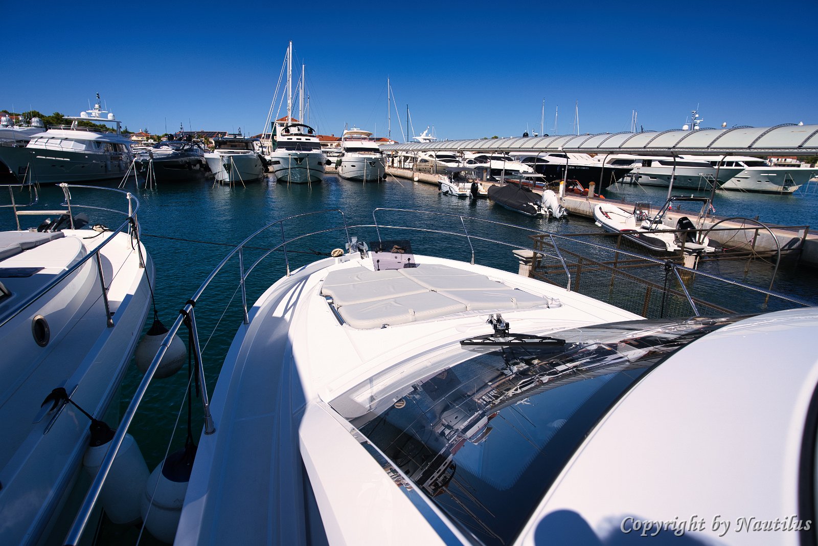 Bow View from Cockpit Looking forward over the sleek hardtop towards the bow sunbathing area.