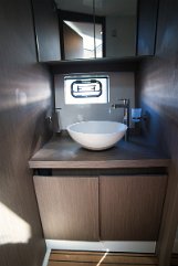 Bathroom Design - Gran Turismo 41 Elegant bowl sink and modern fittings in the head compartment of the motor yacht 'Miami Vice'.
