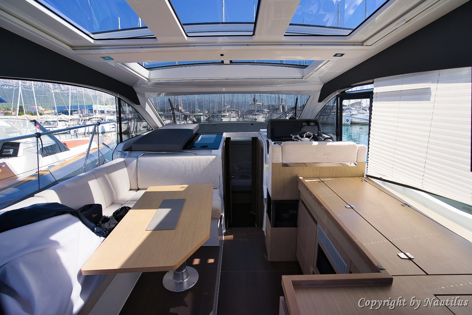 Open Atmosphere Large glass windows surround the salon, filling the interior with natural light.