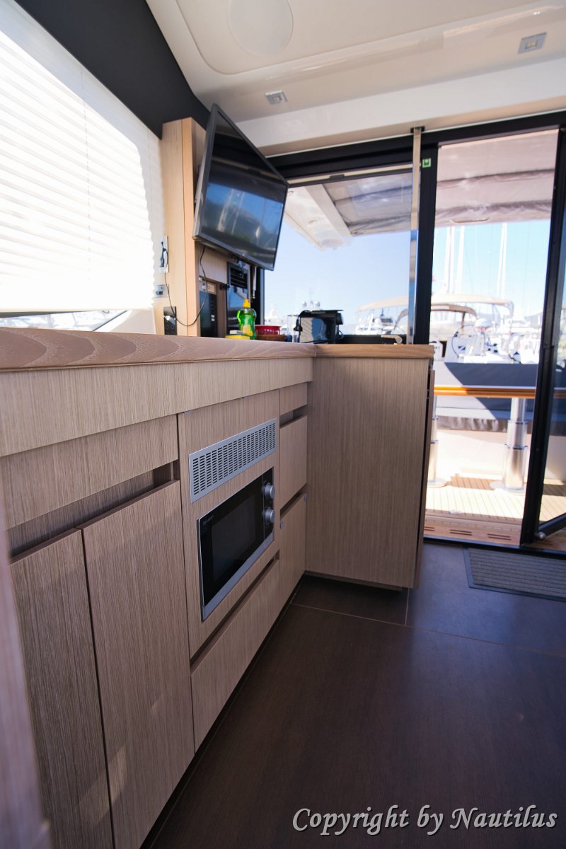 Galley & Storage Practical storage solutions and galley amenities integrated into the salon design.