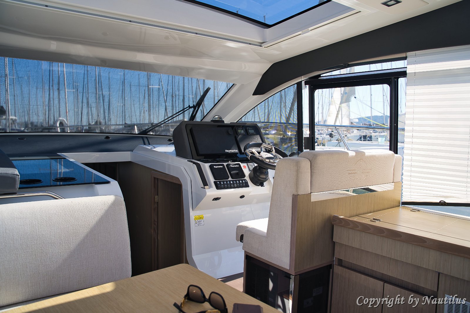 Salon to Cockpit Connection Bi-fold doors (if applicable) or sliding glass opens the salon fully to the aft deck.