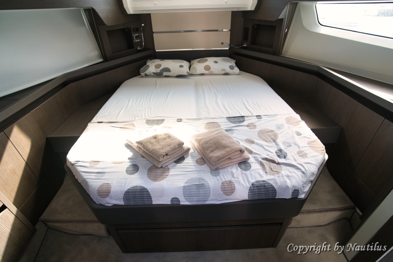 Master Stateroom Comfort Premium mattress and elegant design ensure a restful night's sleep in the main cabin.