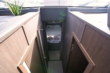 Lower Deck Access Stairs leading from the salon down to the private sleeping quarters.